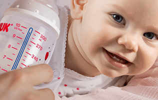 Baby with New Temperature Control Bottle